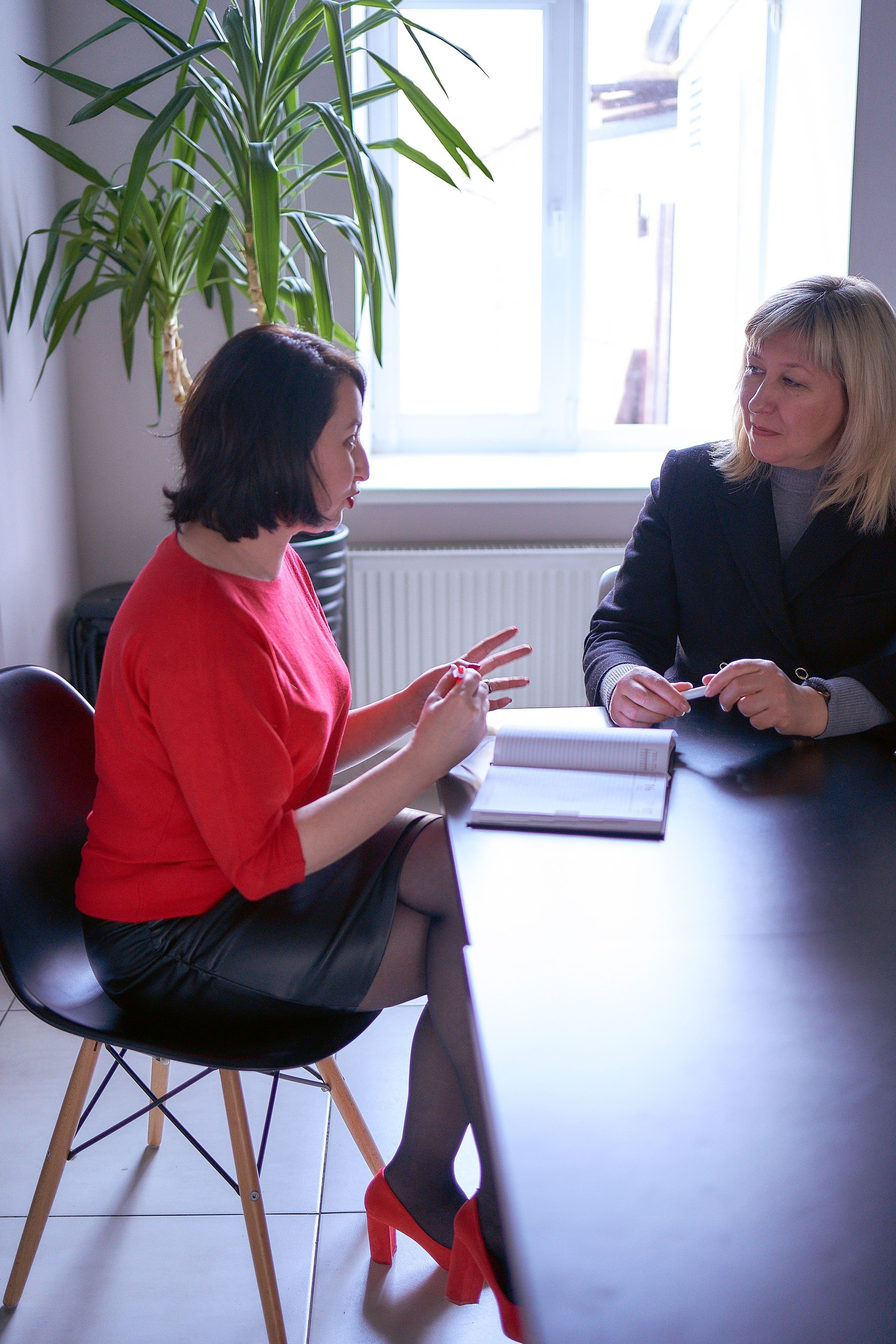a woman receives employment advice from hr in the office